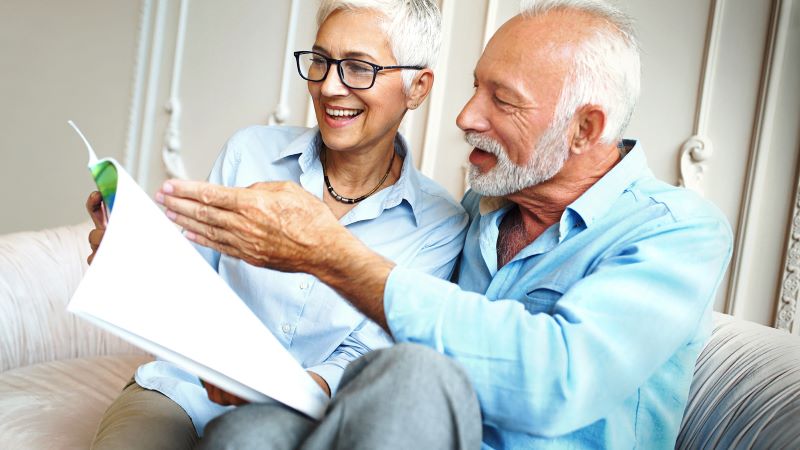 Seniors looking at a document