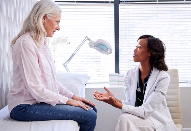 doctor talks to patient