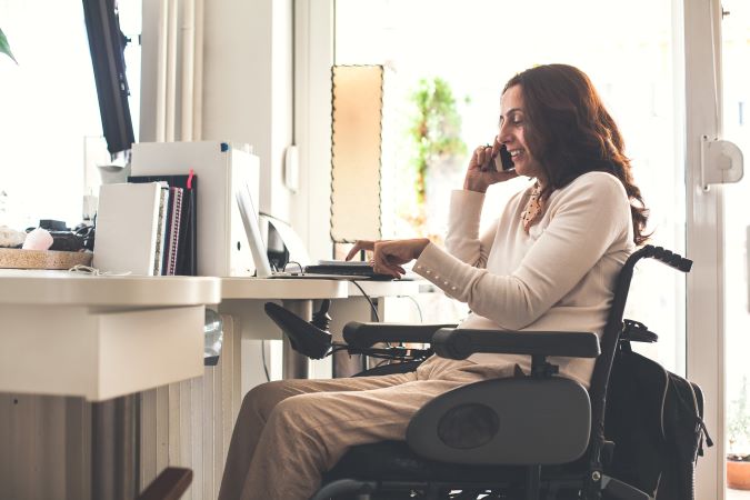 Women in a wheelchair on a laptop