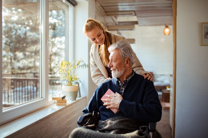 Senior in a wheelchair with daughter