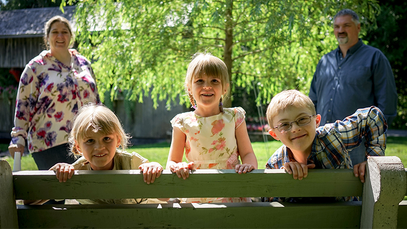 A family with two adults and three children. 