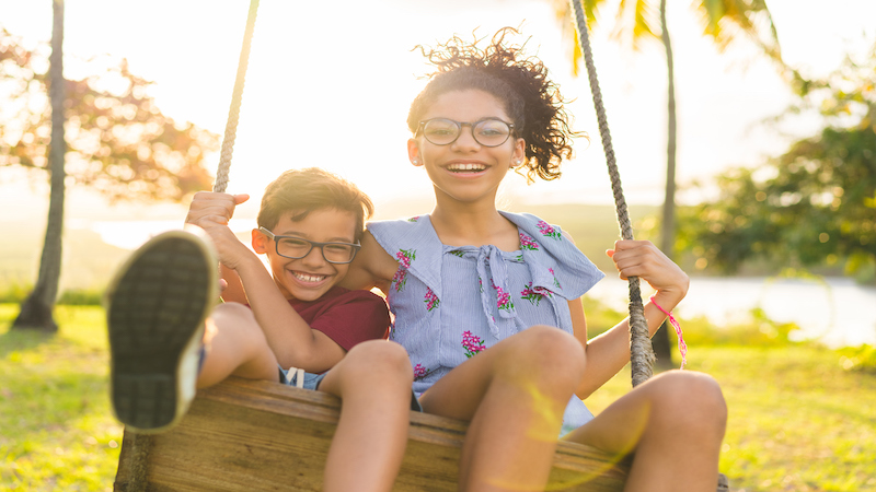 Two children in a swing.