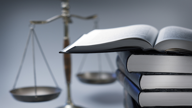 Scales of justice and a stack of books.