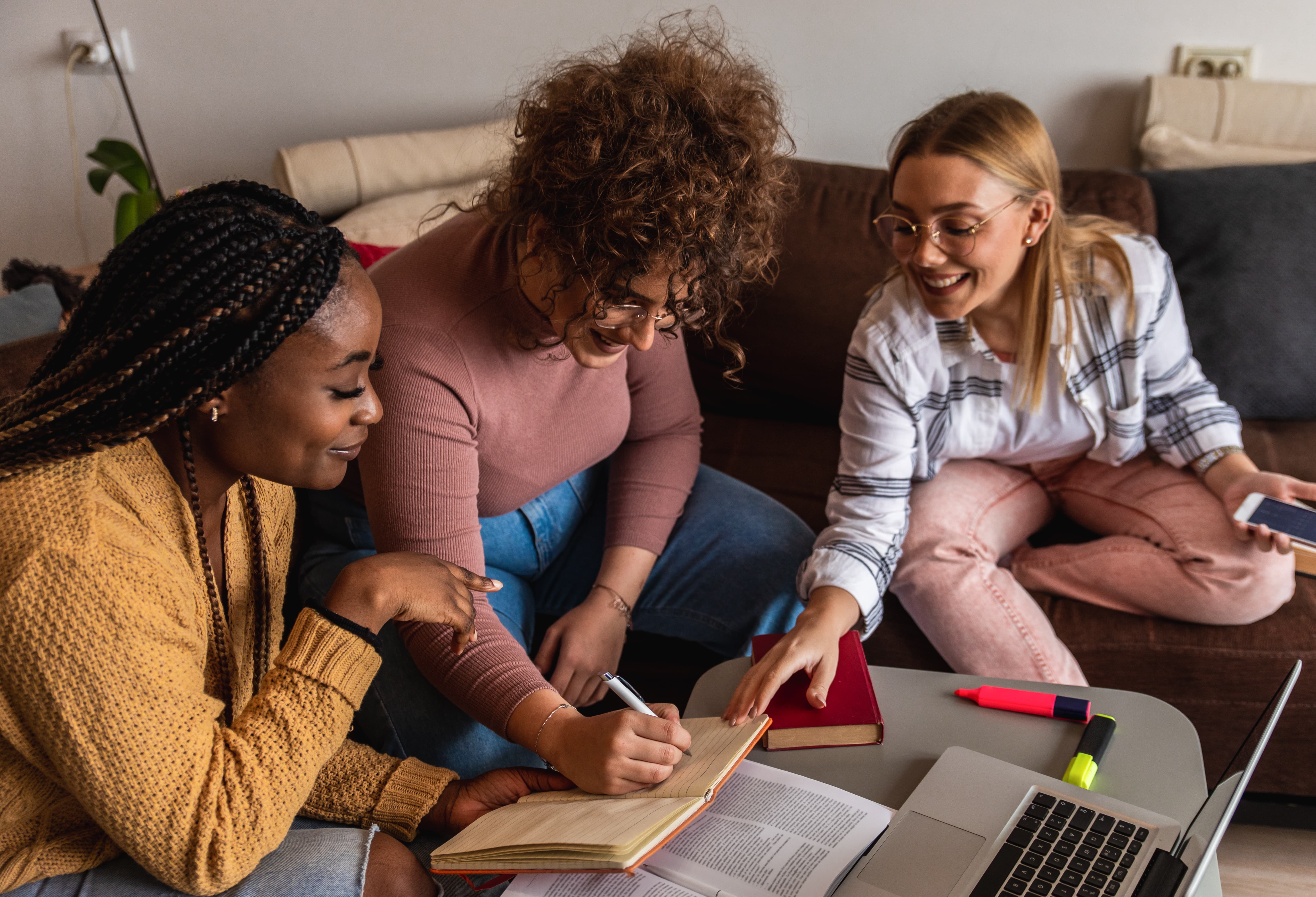 women sitting around coffee table and chatting